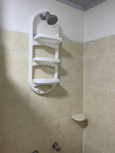 a bathroom with a shower with a shower head at Green Apartment el prado in Girón