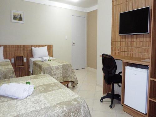 TV a/nebo společenská místnost v ubytování Coral Palace Hotel