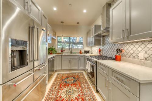 a kitchen with white cabinets and a rug on the floor at A Foodie s Delight in Portland