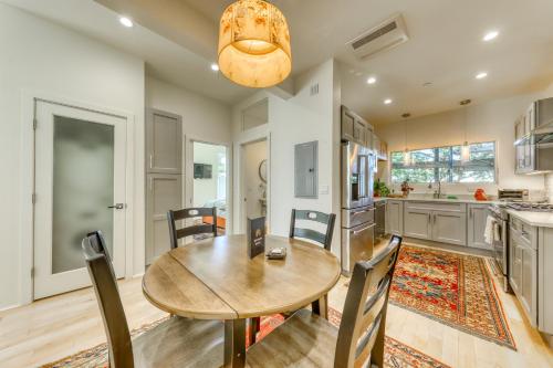 a kitchen and dining room with a wooden table and chairs at A Foodie s Delight in Portland