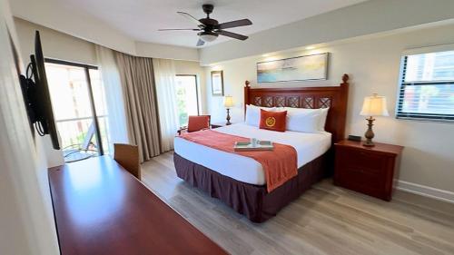 a hotel room with a bed and a ceiling fan at Westgate Lake Resort and Spa ORLANDO in Orlando