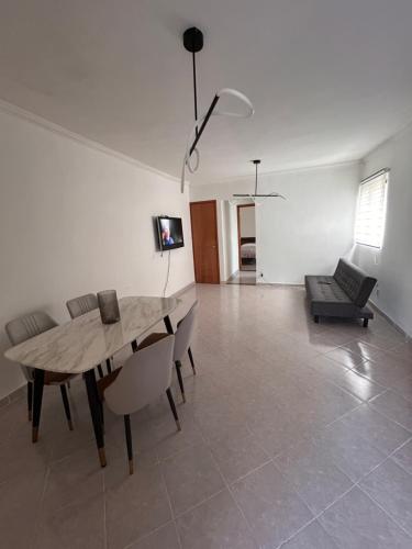 a dining room with a wooden table and chairs at Departamento a una cuadra del angel de la independencia in Mexico City