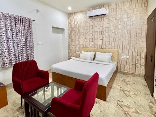 Ένα ή περισσότερα κρεβάτια σε δωμάτιο στο nahargrah villa