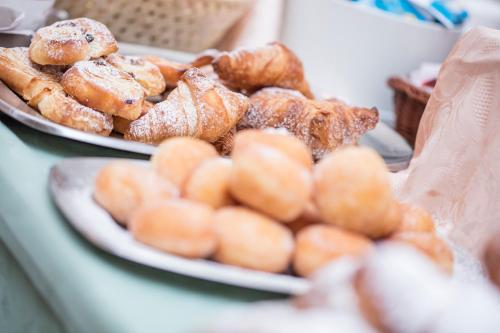 two plates of pastries are sitting on a table at Hotel Sorapiss in Misurina