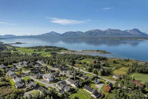 an aerial view of a village on the shore of a lake at Northern Lights View Beautiful Berg in Kuberg