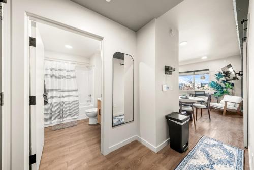 a bathroom with a toilet and a dining room at 2BR in Downtown with Parking in Spokane