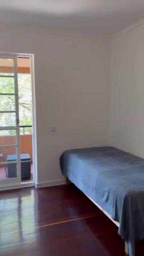 Postel nebo postele na pokoji v ubytování T2 Apartamento Emillian