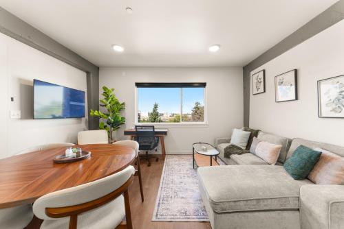 a living room with a table and a couch at Downtown 2br 1bath with Parking in Spokane