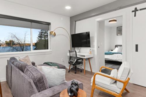 a living room with a couch and a table at DT 2br 2bath Modern Apartment in Spokane