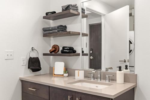 a bathroom with a sink and a mirror at Parkview409 in Spokane