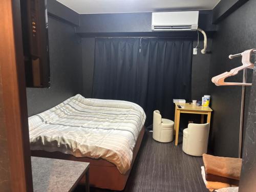 เตียงในห้องที่ LEGALCOURT - Vacation STAY 17899