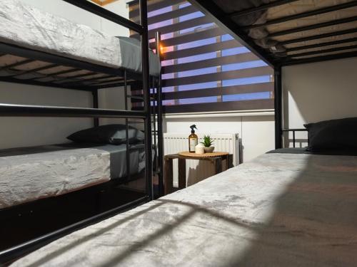 Postel nebo postele na pokoji v ubytování Vive Hostel