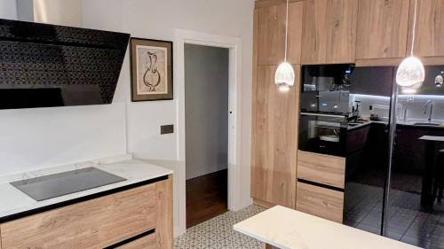 a kitchen with a sink and a stove top oven at Apartamento con garaje en Valladolid in Valladolid