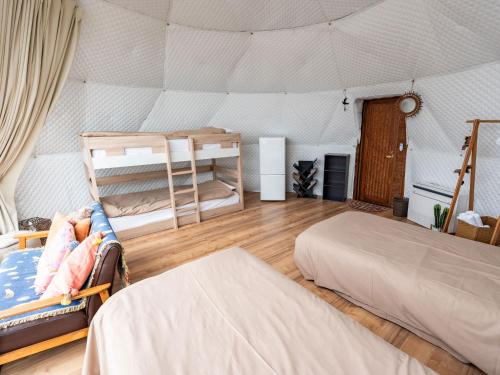 a bedroom with two bunk beds in a tent at Kaamlanai Harbor - Vacation STAY 48796v in Nichinan