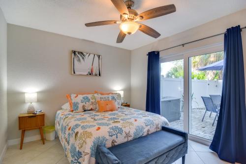 a bedroom with a bed and a ceiling fan at Near Beach! Modern Ground-Floor Condo in St Pete in St Pete Beach