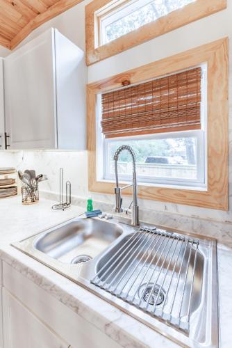 a kitchen with a sink and a window at Unit A Casa Cabana in Madison