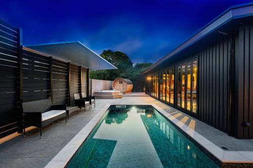 a house with a swimming pool next to a building at Grand Resort Shirahama - Vacation STAY 72313v in Hongō