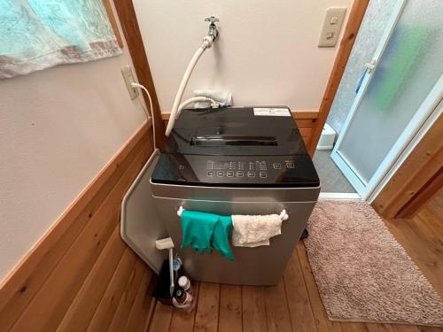 a stove with a towel on it in a room at Yudensya - Vacation STAY 00050v in Kiyohashi