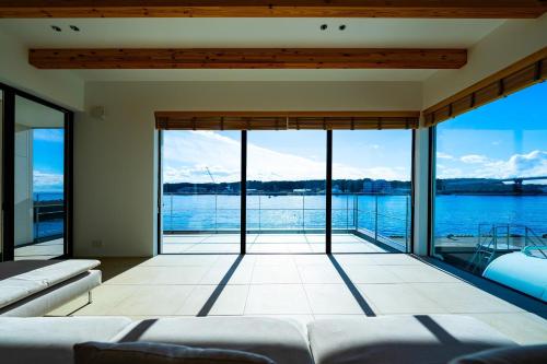 a living room with a view of the water at theView Harumicho, Miura City - Vacation STAY 19927 in Misakimachi-Koajiro