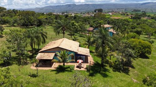 an aerial view of a small house in a field at Pousada & Chalés Quinta da Nascente - Serra da Canastra in Delfinópolis