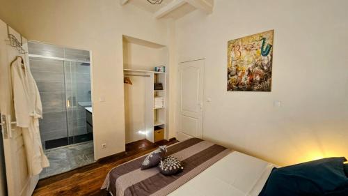 a small bedroom with a bed and a shower at Katarina in Sainte-Thérèse