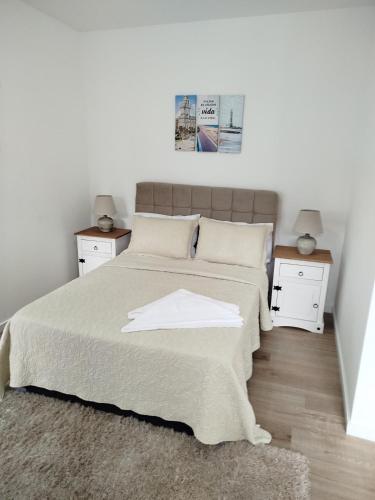 a bedroom with a large bed with two night stands at let health flow in Montevideo