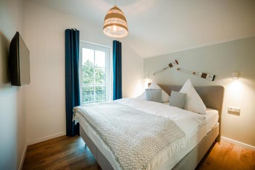 Ένα ή περισσότερα κρεβάτια σε δωμάτιο στο Ferienhaus Strandgold