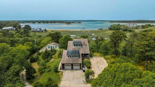 an aerial view of a house with a view of the water at Sweeping Views Minutes to Beach in Chatham