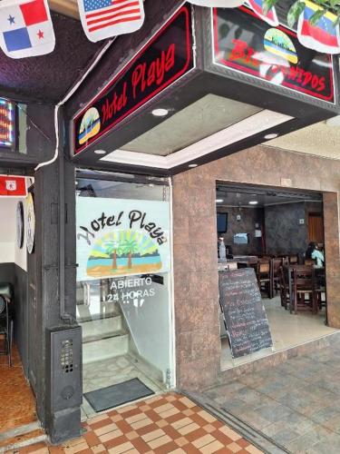 a fast food restaurant with a sign that reads meal pizza at Hotel Playa Itagui in Itagüí
