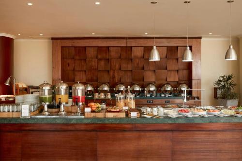 a restaurant with a buffet of food at Marriott Venezuela Hotel Playa Grande in Playa Grande