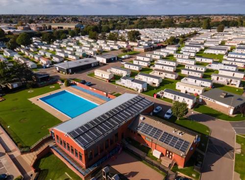 an aerial view of a building with a pool at Coastal Retreats in Great Clacton
