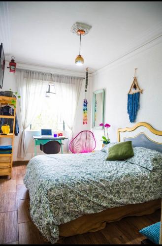 a bedroom with a bed and a desk at Lovely cozy & spacious room in heart of Condesa in Mexico City