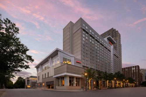 a tall building in front of a building at Raleigh Marriott City Center in Raleigh