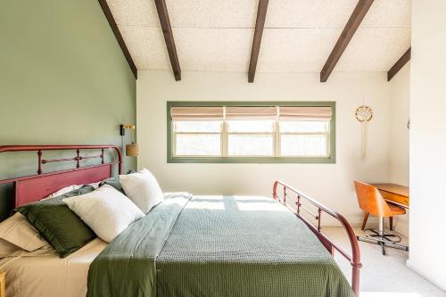 a bedroom with a bed and a desk at Beech Mountain Escape with Views in Beech Mountain