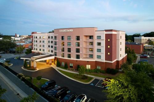a rendering of a hotel with a parking lot at Courtyard by Marriott Carrollton in Carrollton