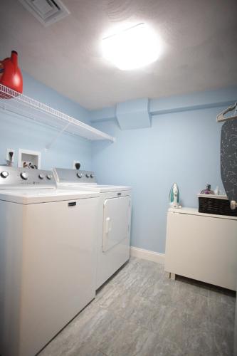 a kitchen with a white stove and a sink at Peaceful 2BR near US Route 1 and Boston in Melrose
