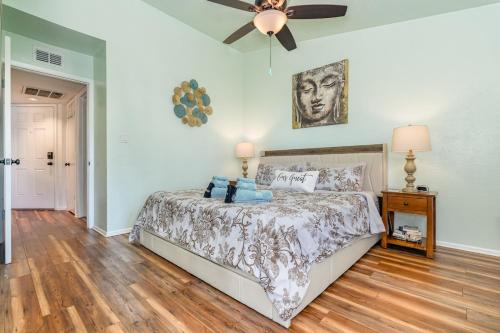 a bedroom with a bed and a ceiling fan at Serene Zen King Bed Condo - Half Mile from Beach in Melbourne