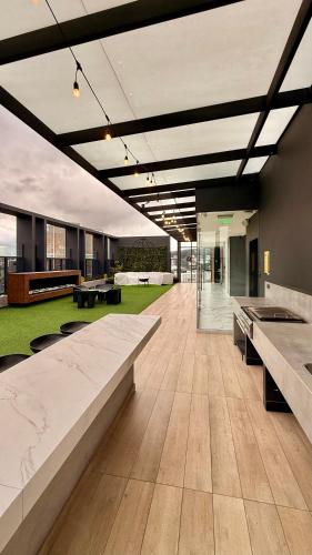 a large room with benches in a building at Lujosas suites XOE in Quito