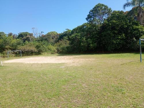 a soccer field with a goal in the grass at Apartmento Itanhaem in Itanhaém