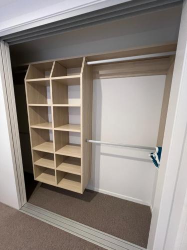 a closet in a room with a door open at Mountain Escape in Jacks Point in Queenstown