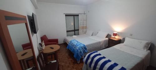 Llit o llits en una habitació de Golden House