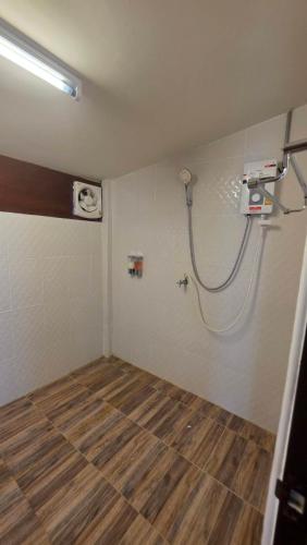 an empty room with a shower in the wall at DGD Chiangmai in Mae Rim