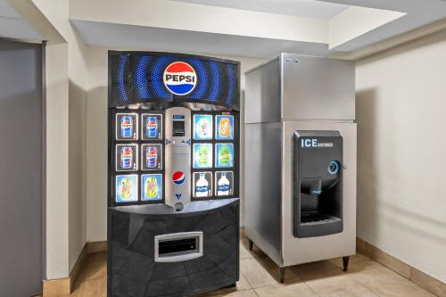 a krispy kreme ice cream machine in a room at Red Carpet Inn and Suites in Bellmawr