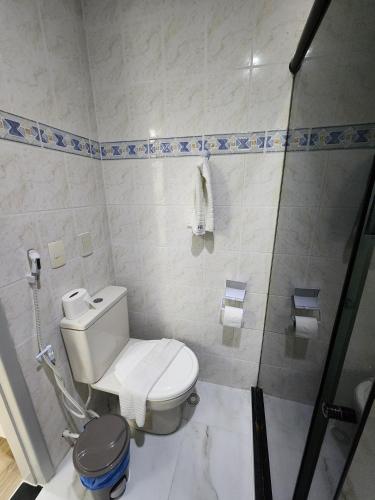 a bathroom with a toilet and a shower at BOA VIAGEM FLATS APTO 201 in Recife