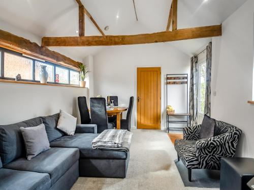 a living room with a couch and chairs at The Barn in Martham