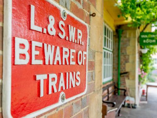 a red sign on the side of a building at Sprat & Winkle in Horsebridge