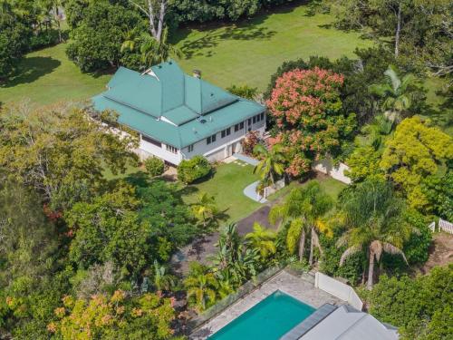 an aerial view of a house with a swimming pool at Fig Tree House in Teven