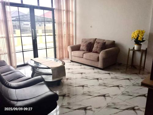 O zonă de relaxare la Minamo Homestay Modern Tengah Kota Payakumbuh