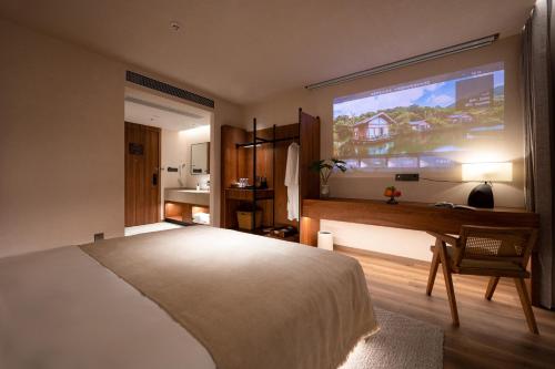 a bedroom with a bed and a large window at 大有观于All about Yu Hotel in Chongqing