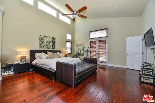 a bedroom with a bed and a ceiling fan at Beautiful, Spacious Agoura Malibu Zen House in Agoura Hills